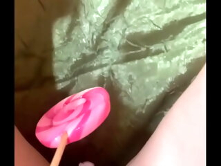 Virgin plays with candy